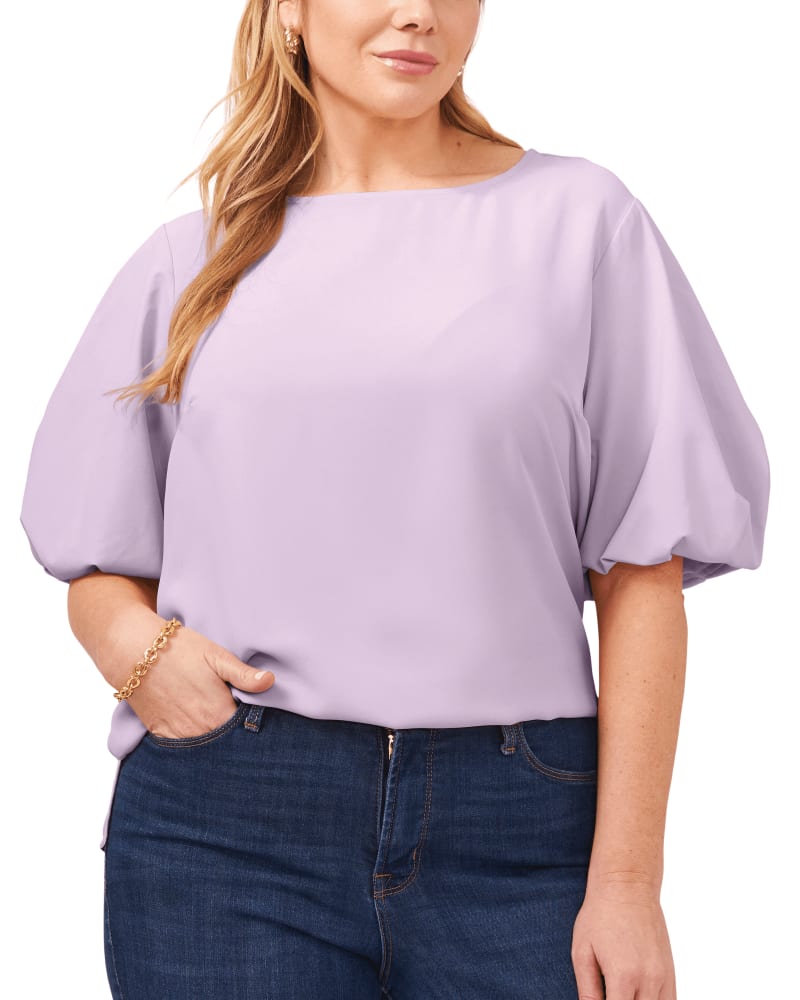 Front of a model wearing a size 1X Luxe Puff Sleeve Blouse in Soft Iris by Vince Camuto. | dia_product_style_image_id:261374